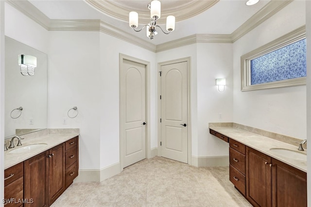 bathroom featuring vanity, an inviting chandelier, crown molding, and a tray ceiling