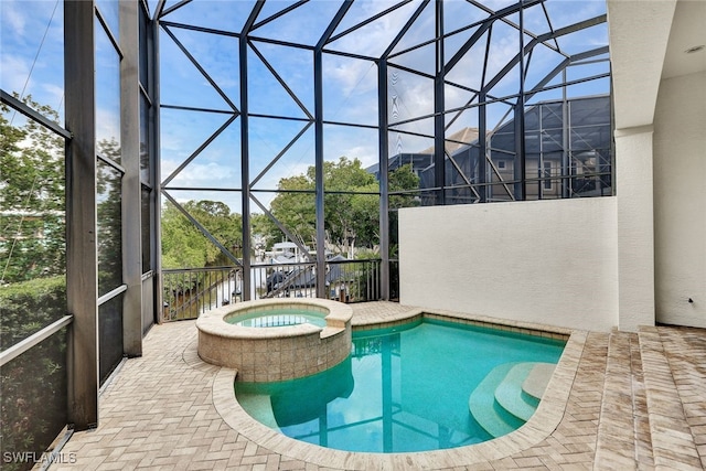 27588 River Reach Dr, Bonita Springs, FL 34134 - view of swimming pool featuring a pool with connected hot tub, a lanai, and a patio area