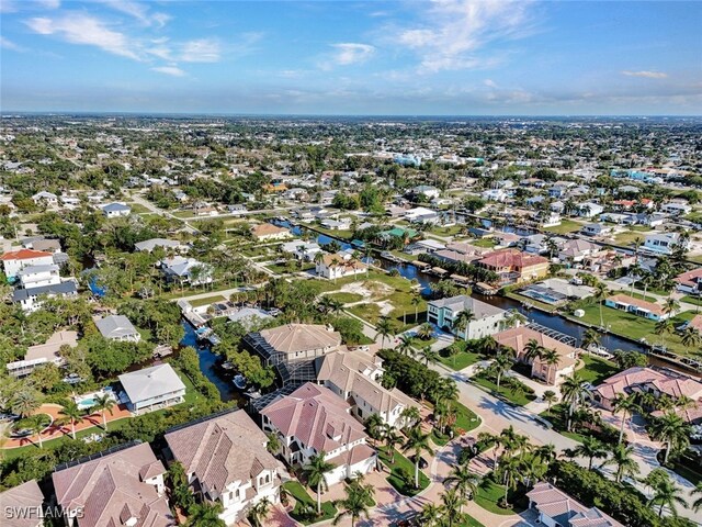 27588 River Reach Dr, Bonita Springs, FL 34134 - aerial view of property and surrounding area featuring nearby suburban area and a nearby body of water