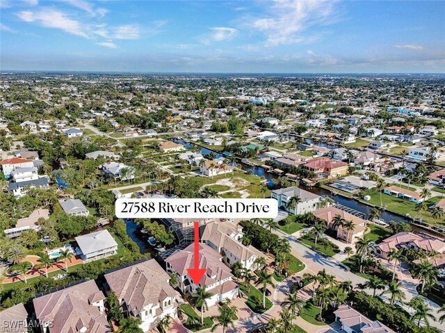 27588 River Reach Dr, Bonita Springs, FL 34134 - aerial view of property's location featuring nearby suburban area and a large body of water