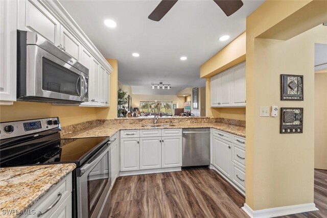 kitchen with white cabinets, stainless steel appliances, and sink