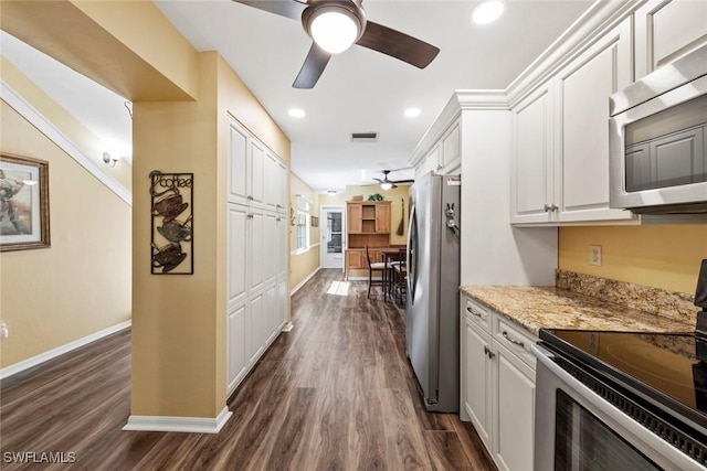 kitchen with crown molding, white cabinets, dark hardwood / wood-style floors, and appliances with stainless steel finishes