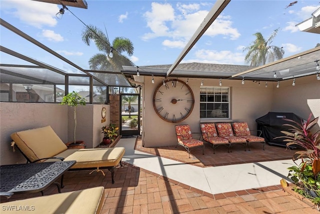 view of patio with outdoor lounge area, grilling area, and a lanai