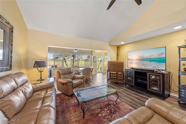 living room featuring high vaulted ceiling, dark hardwood / wood-style floors, and ceiling fan