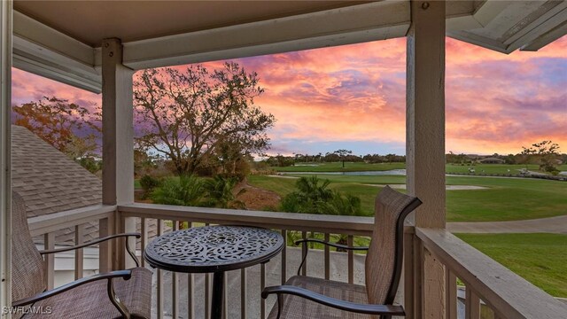 view of balcony at dusk