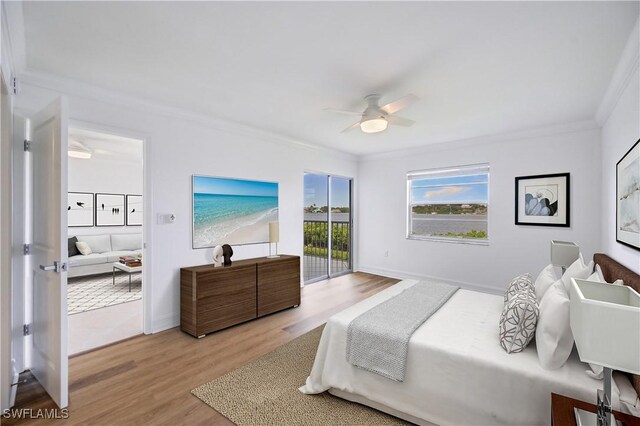 bedroom featuring access to exterior, light wood-type flooring, ceiling fan, and crown molding