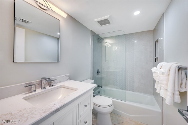 full bathroom with toilet, tile patterned flooring, vanity, and combined bath / shower with glass door