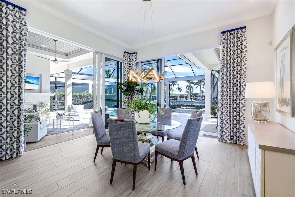 dining space featuring crown molding