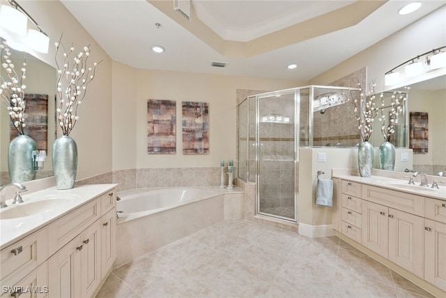 bathroom with tile patterned floors, vanity, and independent shower and bath