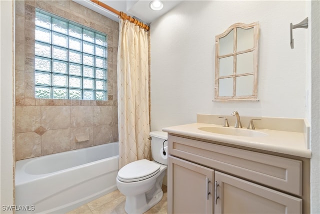 full bathroom with vanity, tile patterned floors, toilet, and shower / tub combo