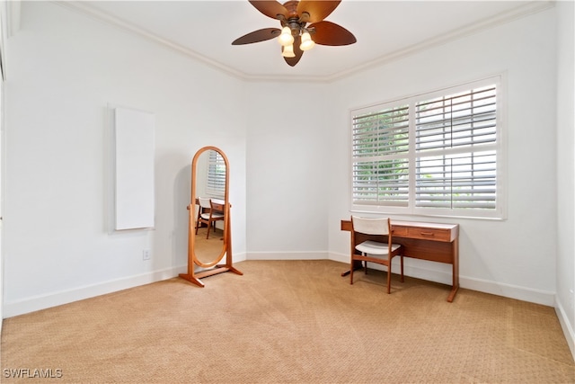 home office featuring light carpet, crown molding, and ceiling fan