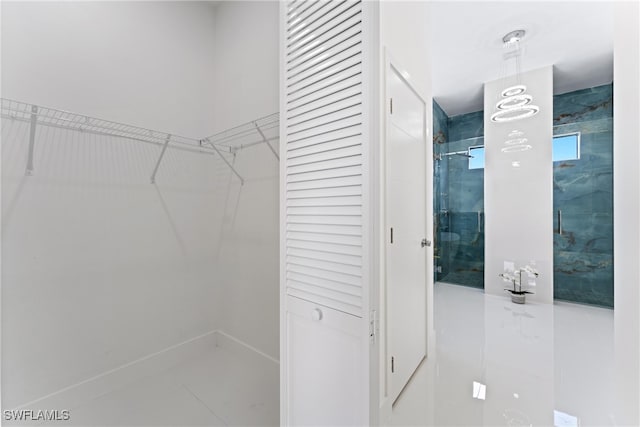 spacious closet featuring tile patterned floors