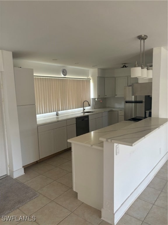 kitchen featuring kitchen peninsula, light tile patterned floors, decorative light fixtures, stainless steel fridge, and black dishwasher