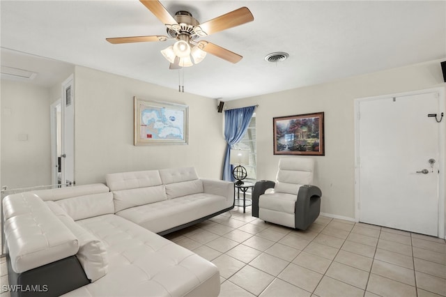 living room with light tile patterned floors and ceiling fan