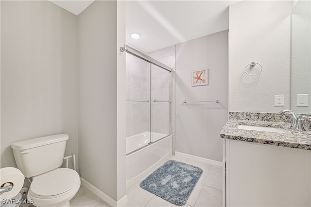 full bathroom featuring vanity, tile patterned floors, enclosed tub / shower combo, and toilet