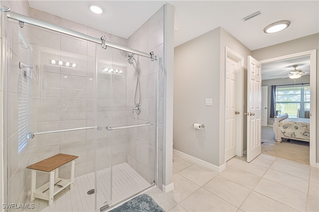 bathroom featuring an enclosed shower and tile patterned flooring