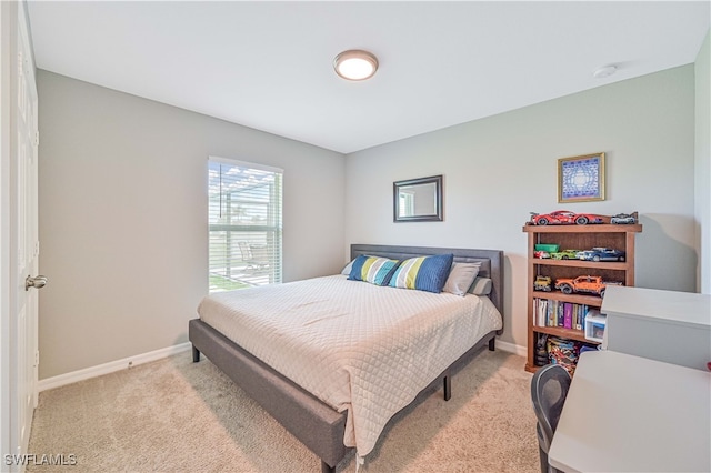 bedroom with light colored carpet