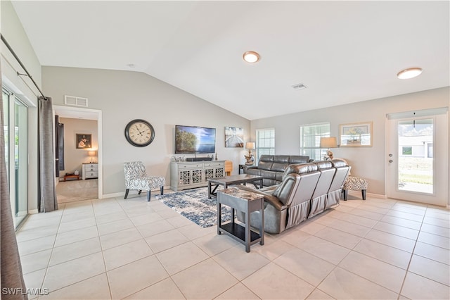 tiled living room with vaulted ceiling