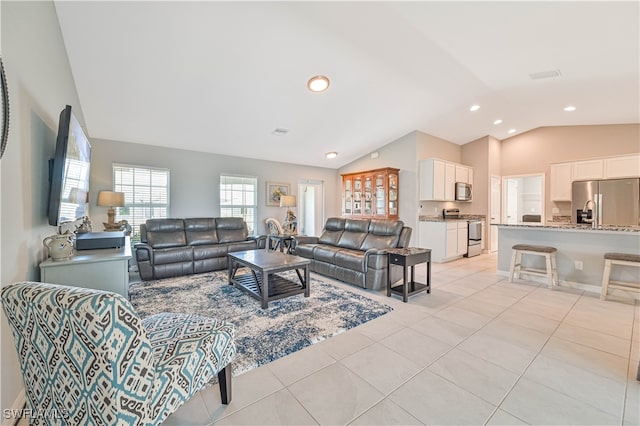 tiled living room with lofted ceiling