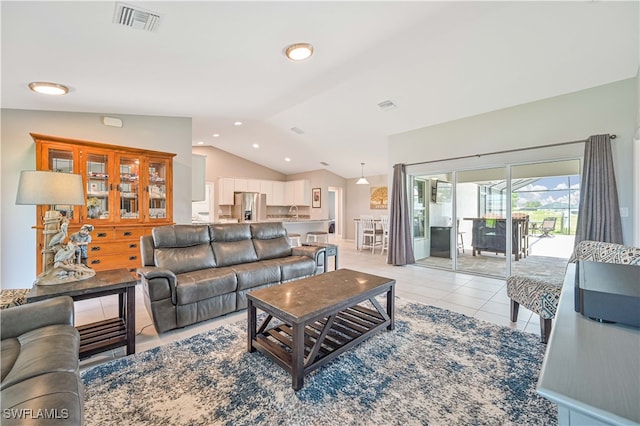 tiled living room with vaulted ceiling