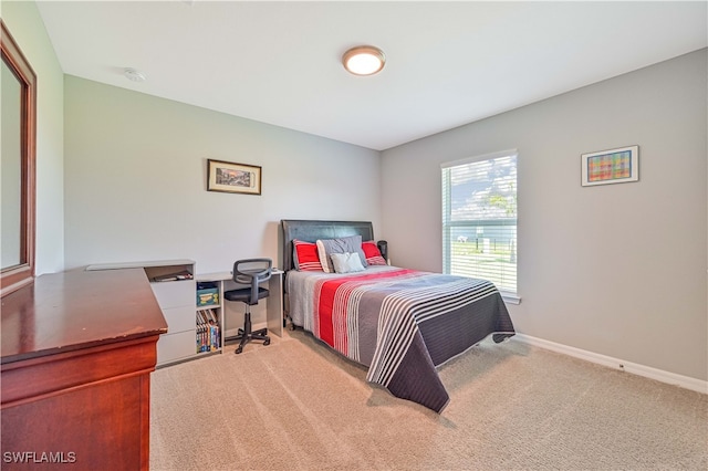 bedroom featuring light colored carpet