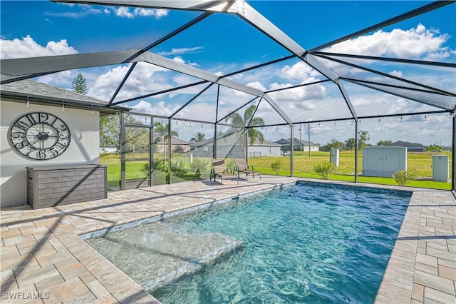 view of pool with a patio, a lanai, and a yard