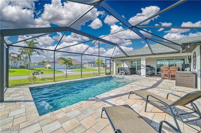 view of pool featuring a patio and glass enclosure