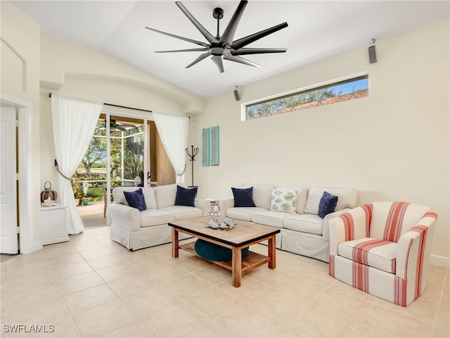 living room with ceiling fan, light tile patterned flooring, and vaulted ceiling