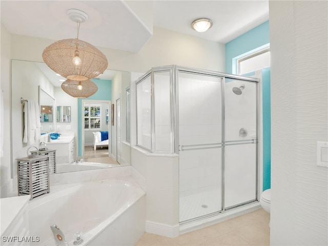 full bathroom featuring toilet, a wealth of natural light, and independent shower and bath