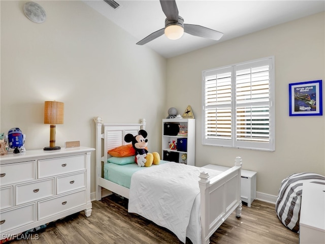 bedroom with hardwood / wood-style floors and ceiling fan