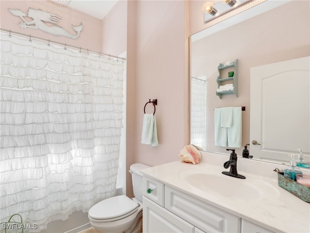 full bathroom featuring vanity, shower / bath combo, and toilet