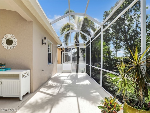 unfurnished sunroom featuring radiator heating unit