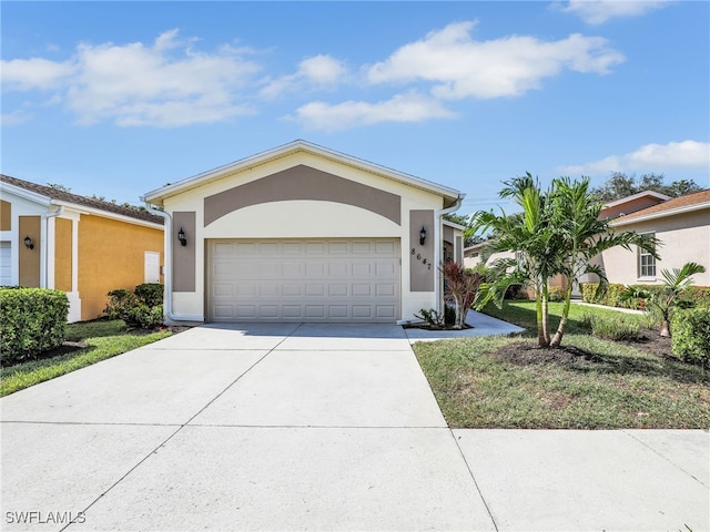 single story home featuring a garage