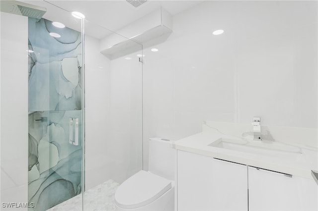 bathroom featuring walk in shower, vanity, and toilet