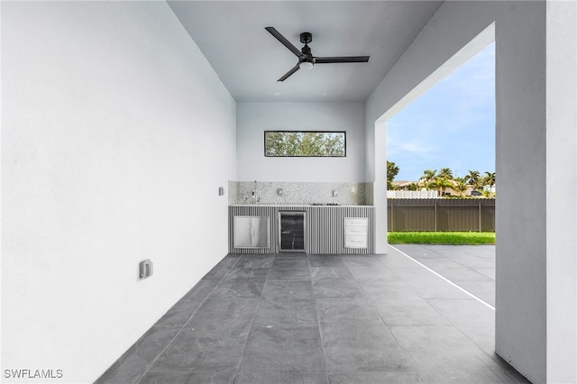 interior space with area for grilling and ceiling fan