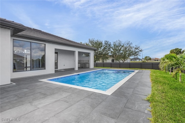 view of swimming pool with a patio area