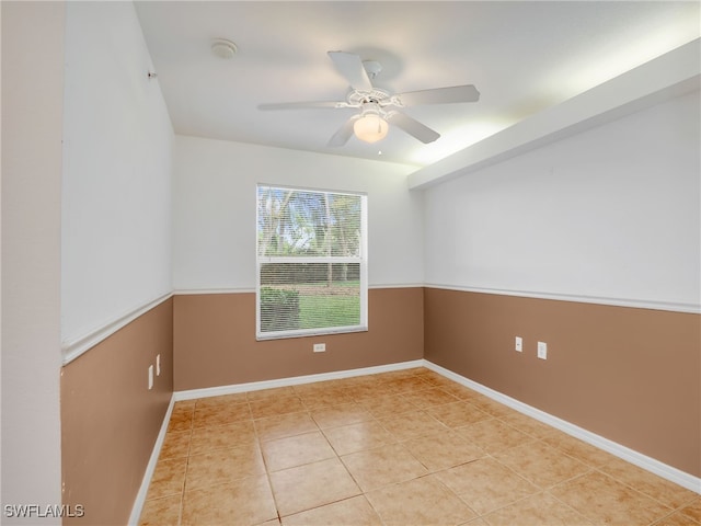 unfurnished room featuring ceiling fan and light tile patterned floors