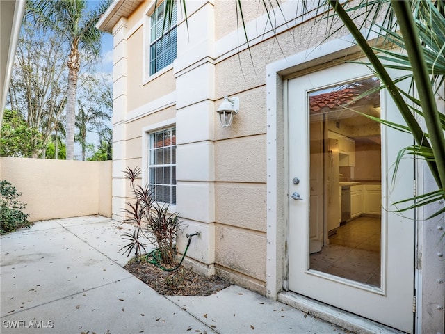 property entrance with a patio area