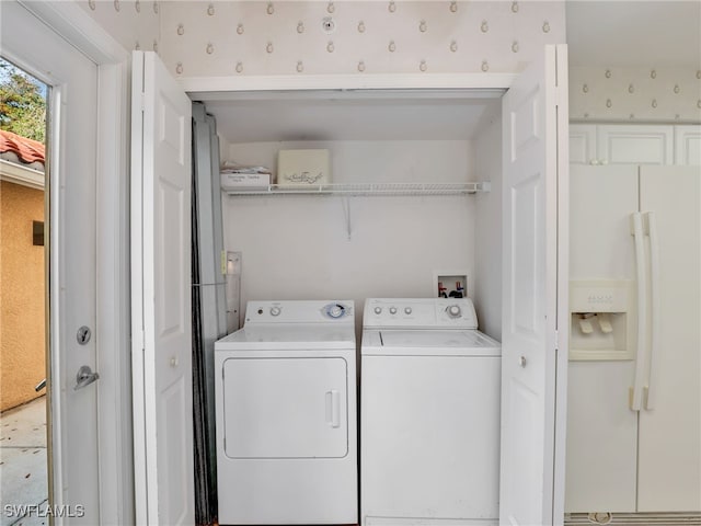 washroom featuring washer and dryer