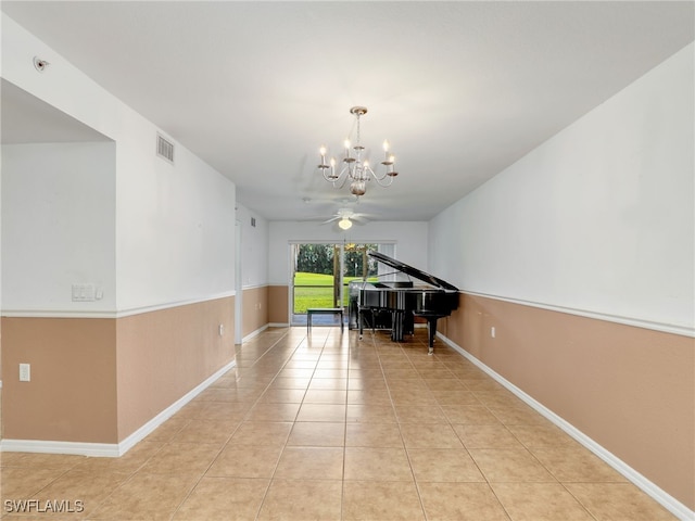 hallway featuring light tile patterned flooring and an inviting chandelier