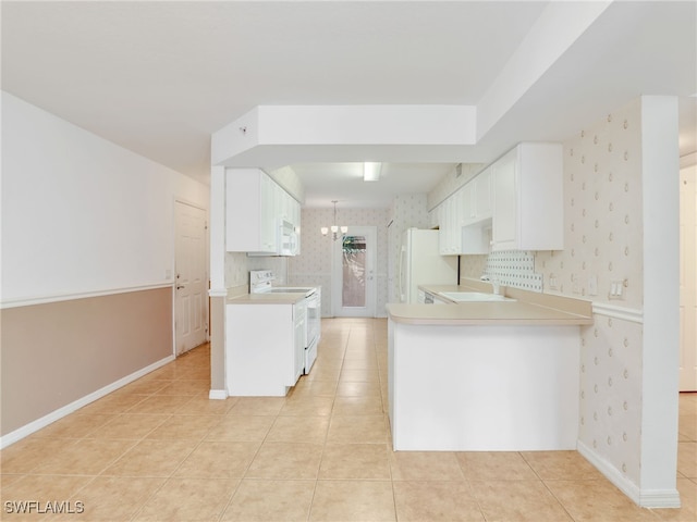 kitchen with white cabinets, light tile patterned floors, white appliances, and kitchen peninsula