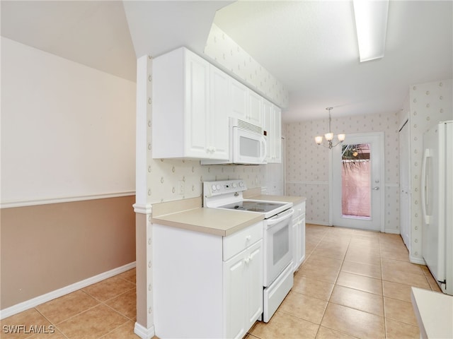 kitchen featuring white cabinets, a notable chandelier, decorative light fixtures, white appliances, and light tile patterned flooring