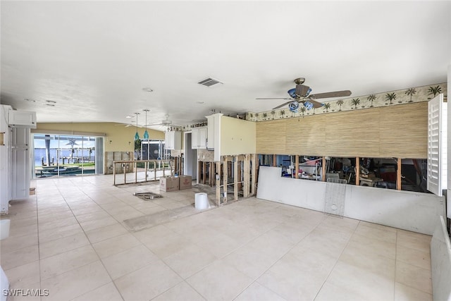 tiled empty room with ceiling fan