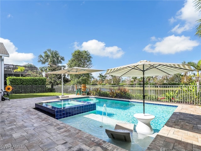 view of swimming pool with pool water feature, a patio, and an in ground hot tub