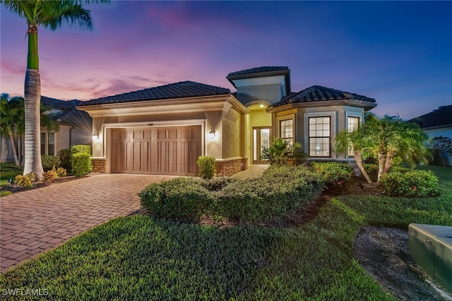 mediterranean / spanish-style home featuring a garage