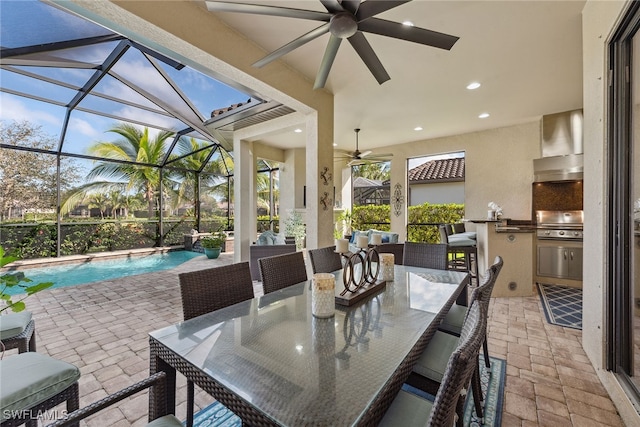 view of patio / terrace featuring glass enclosure, grilling area, area for grilling, and ceiling fan