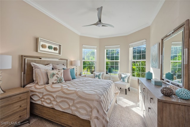 bedroom featuring light colored carpet, ceiling fan, and crown molding