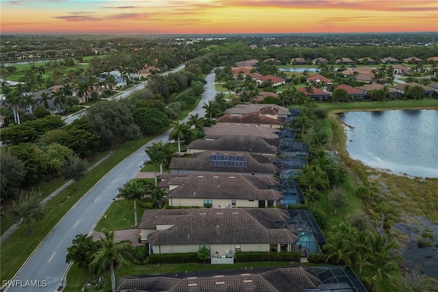 aerial view at dusk with a water view