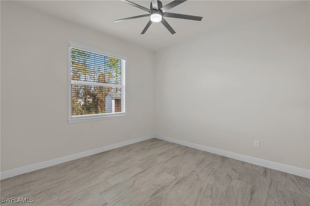 unfurnished room with ceiling fan