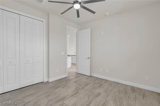 unfurnished bedroom with a closet and ceiling fan